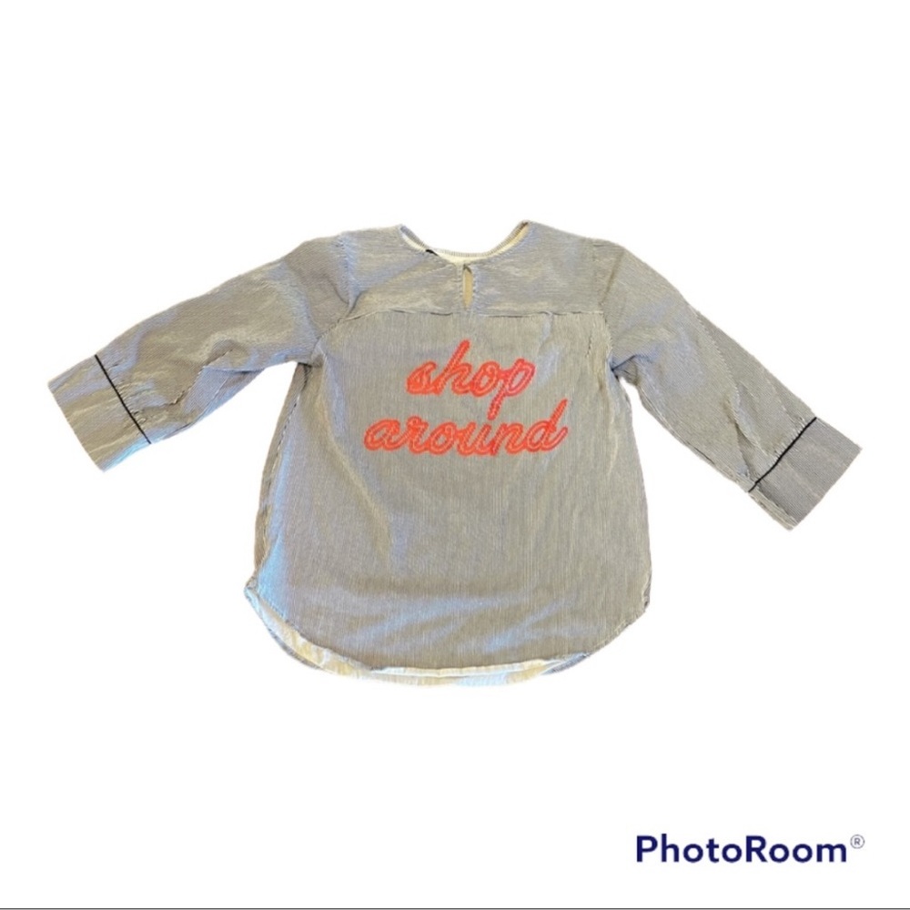 Zara striped top with “shop around” graphic on back
